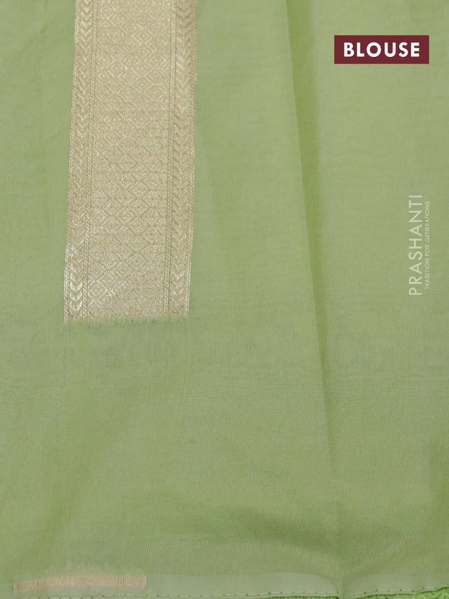 Banarasi cotton saree pista gteen with allover zari weaves and floral embroidery border