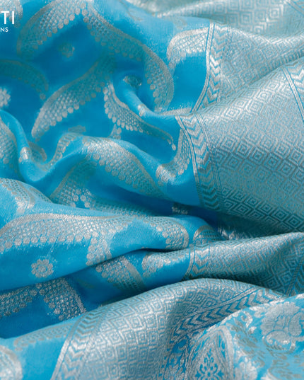 Banarasi cotton saree light blue with allover silver zari weaves and zari woven floral embroidery work border