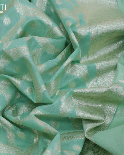Banarasi cotton saree pastel green with allover zari weaves and zari woven floral embroidery work border