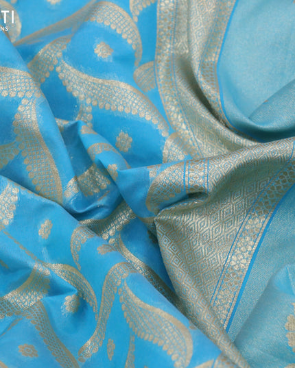 Banarasi cotton saree light blue with allover zari weaves and zari woven floral embroidery work border