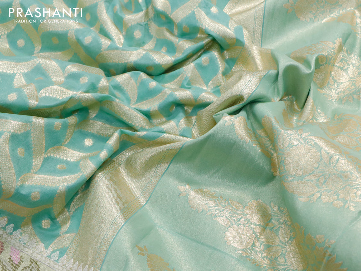 Banarasi cotton saree pasteal green with allover zari weaves and zari woven floral embroidery work border