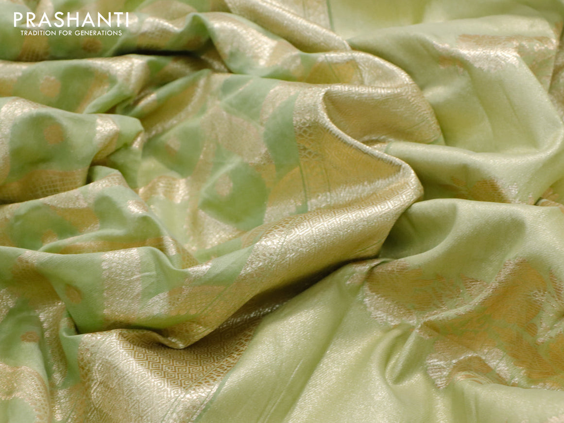 Banarasi cotton saree pista green with allover zari weaves and zari woven floral embroidery work border