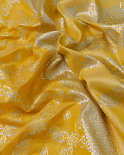 Banarasi cotton saree yellow with allover zari weaves and zari woven floral embroidery work border