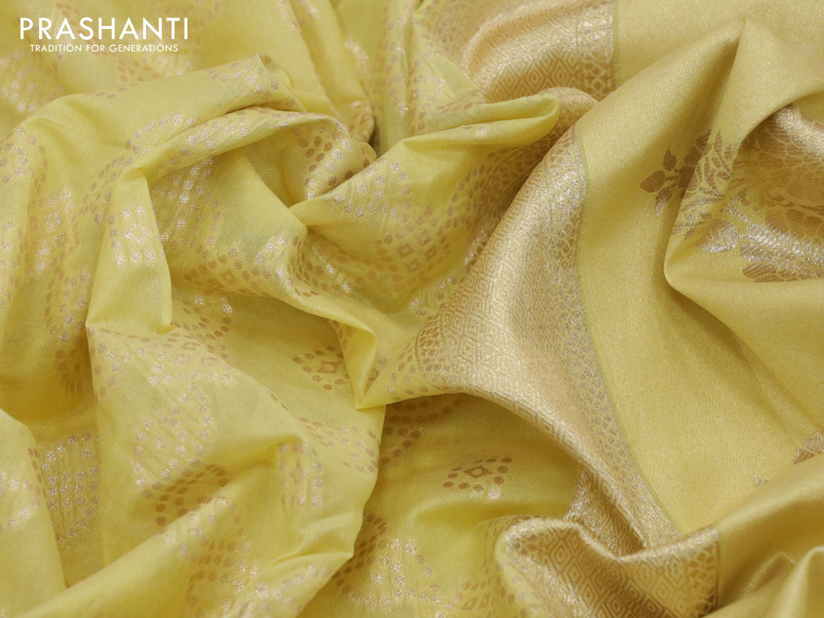 Banarasi cotton saree pale yellow with allover zari weaves and zari woven floral embroidery work border