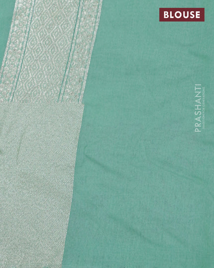 Banarasi cotton saree pastel green with allover zari weaves and zari woven floral embroidery work border