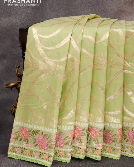 Banarasi cotton saree pista green with allover zari weaves and floral embroidery work border