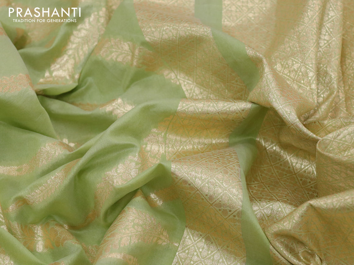 Banarasi cotton saree pista green with allover zari weaves and floral embroidery work border