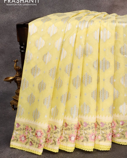 Banarasi cotton saree pale yellow with allover silver & gold zari woven buttas and floral embroidery work border