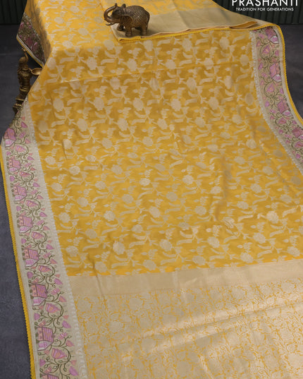 Banarasi cotton saree yellow with allover zari floral weaves and zari woven embroidery work border