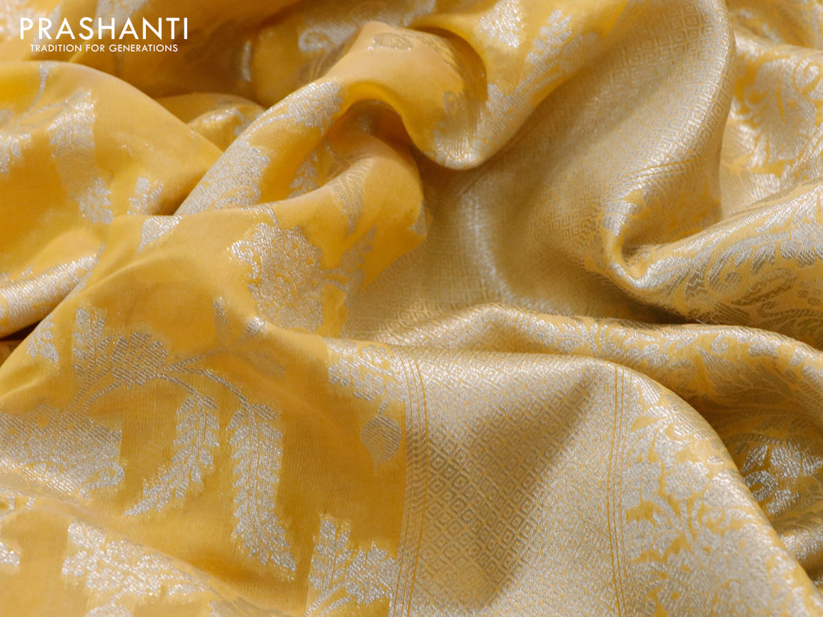 Banarasi cotton saree yellow with allover zari floral weaves and zari woven embroidery work border