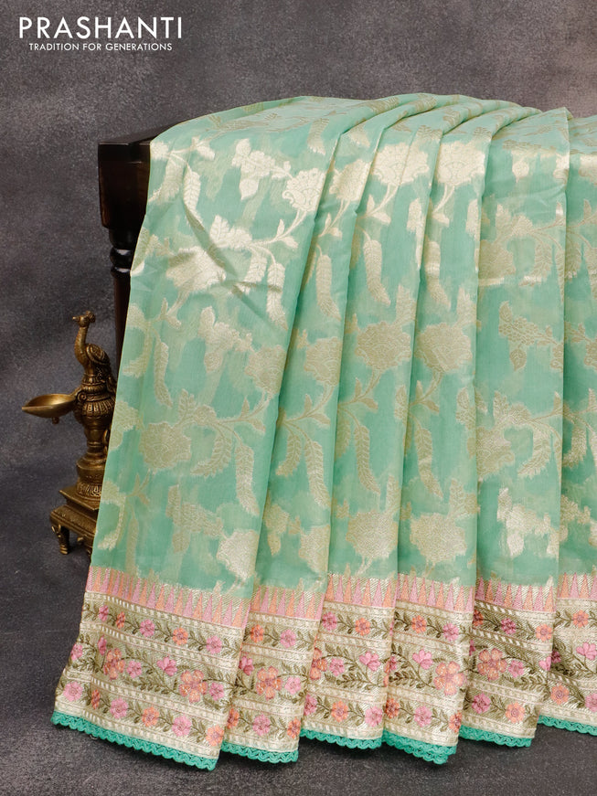 Banarasi cotton saree pista green with allover silver zari floral weaves and zari woven embroidery work border
