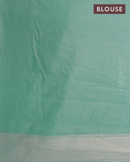 Banarasi cotton saree pastel green with allover silver zari floral weaves and zari woven embroidery work border