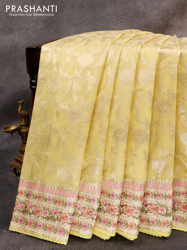 Banarasi cotton saree yellow with allover silver zari floral weaves and zari woven embroidery work border