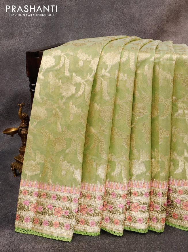 Banarasi cotton saree pista green with allover zari floral weaves and zari woven embroidery work border