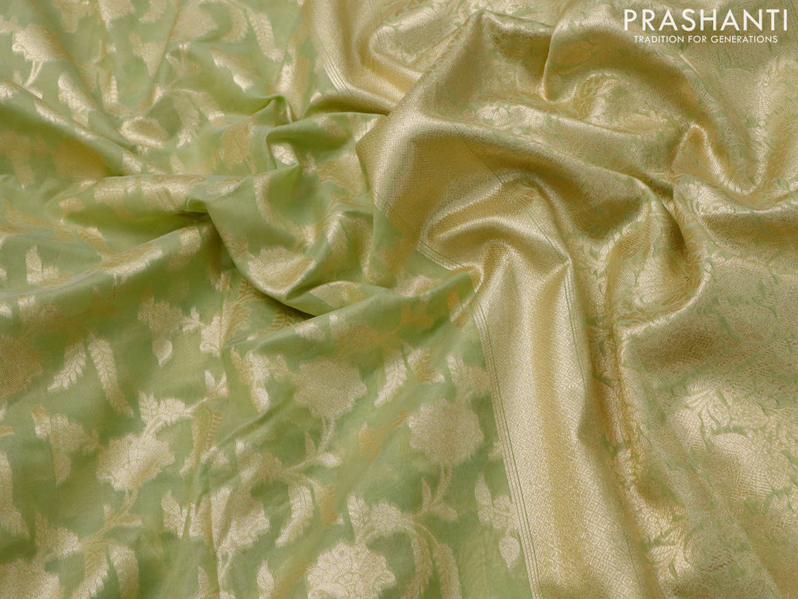 Banarasi cotton saree pista green with allover zari floral weaves and zari woven embroidery work border