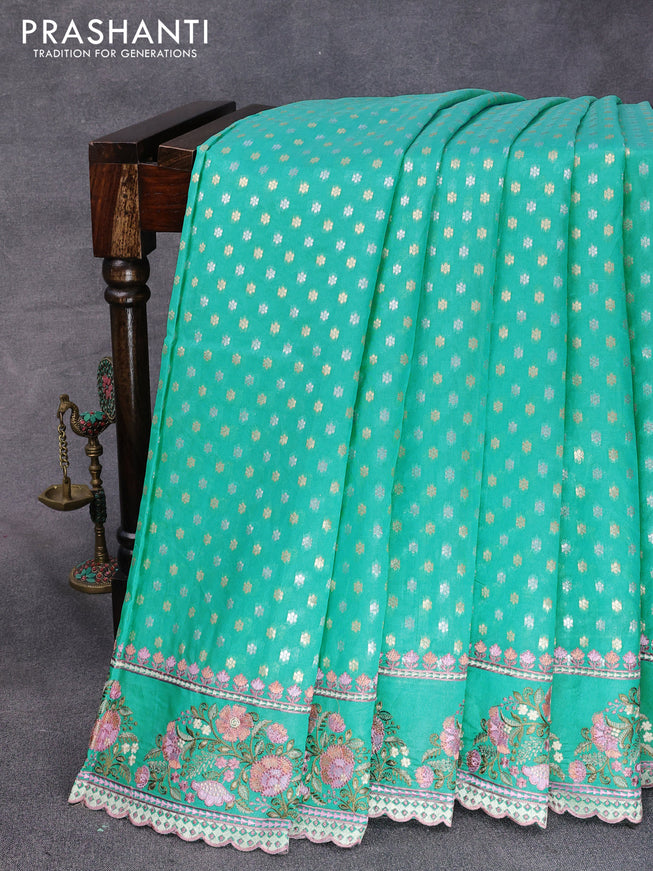 Banarasi cotton saree teal blue with allover silver & gold zari butta weaves and floral embroidery butta border