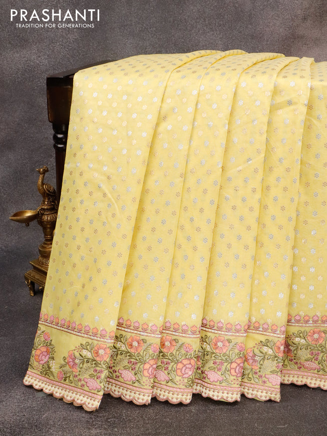 Banarasi cotton saree pale yellow with allover silver & gold zari butta weaves and floral embroidery butta border