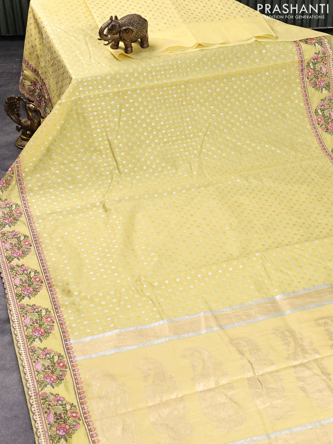 Banarasi cotton saree pale yellow with allover silver & gold zari butta weaves and floral embroidery butta border