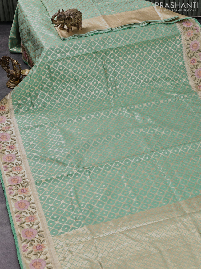 Banarasi cotton saree pastel green with allover zari weaves and zari woven embroidery work border