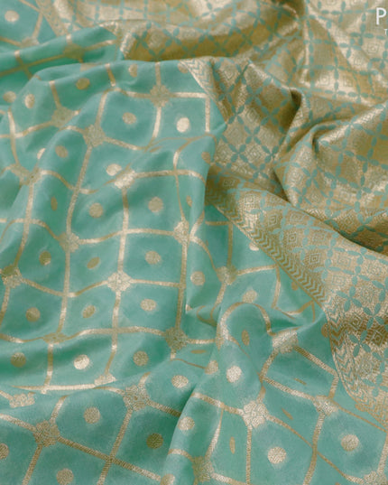 Banarasi cotton saree pastel green with allover zari weaves and zari woven embroidery work border