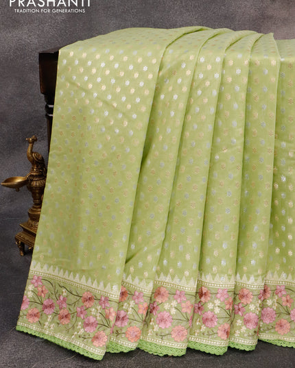 Banarasi cotton saree pista green with allover silver & gold zari woven butta weaves and floral embroidery border