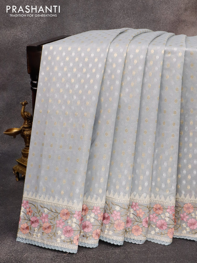 Banarasi cotton saree grey with allover silver & gold zari woven butta weaves and floral embroidery border