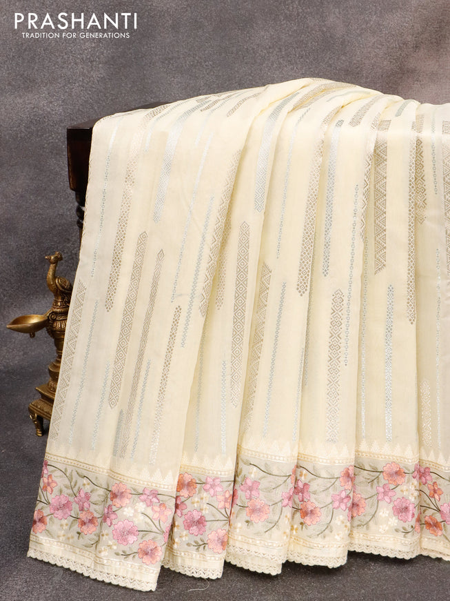 Banarasi cotton saree cream with allover silver & gold zari woven butta weaves and floral embroidery border