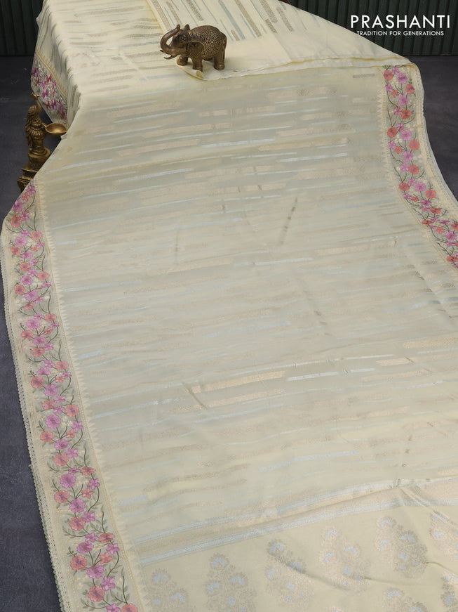 Banarasi cotton saree cream with allover silver & gold zari woven butta weaves and floral embroidery border
