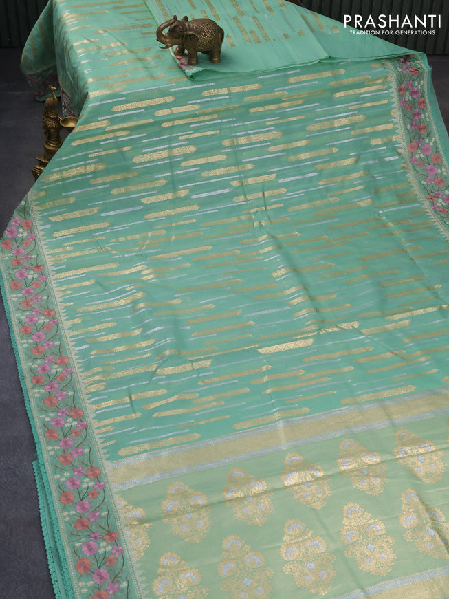 Banarasi cotton saree teal green shade with allover silver & gold zari woven butta weaves and floral embroidery border