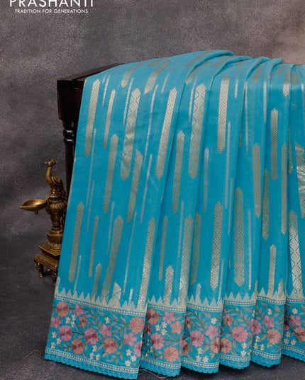 Banarasi cotton saree light blue with allover silver & gold zari woven butta weaves and floral embroidery border