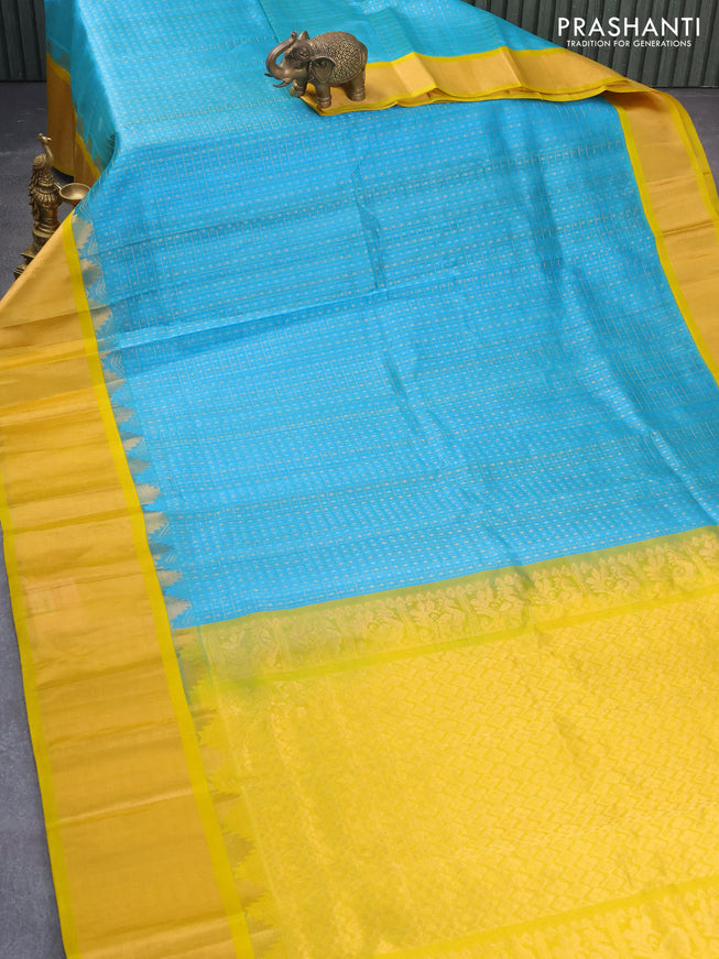 Kuppadam silk cotton saree light blue and yellow with allover zari checks & buttas and temple design zari woven border