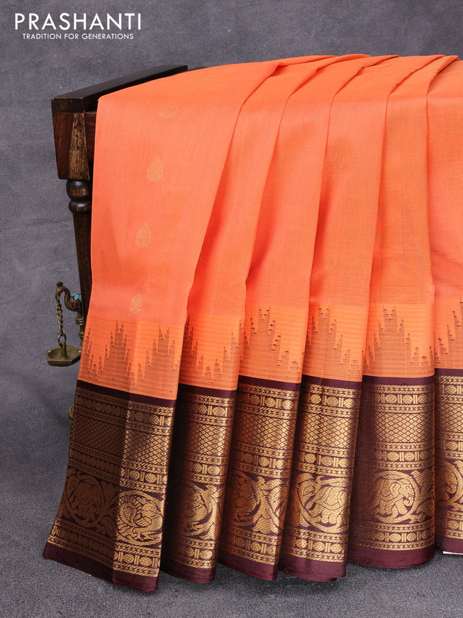 Kuppadam silk cotton saree peach orange and wine shade with zari woven buttas and temple design zari woven border