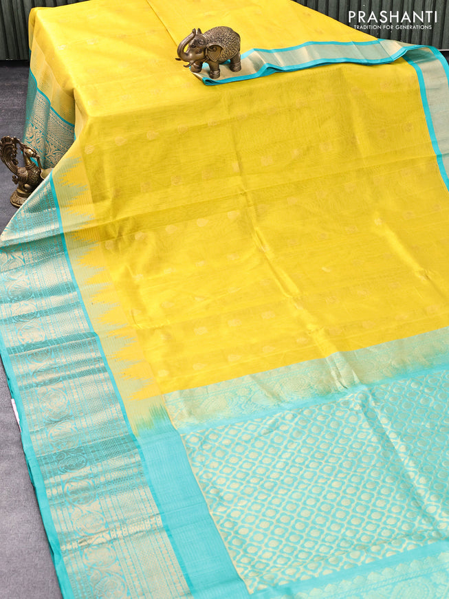 Kuppadam silk cotton saree mustard shade and teal blue with zari woven buttas and temple design zari woven border