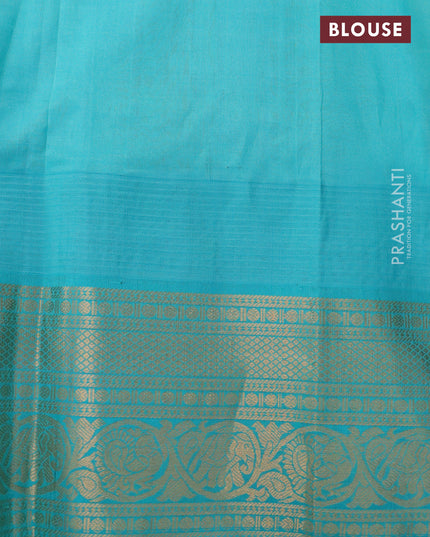 Kuppadam silk cotton saree mustard shade and teal blue with zari woven buttas and temple design zari woven border