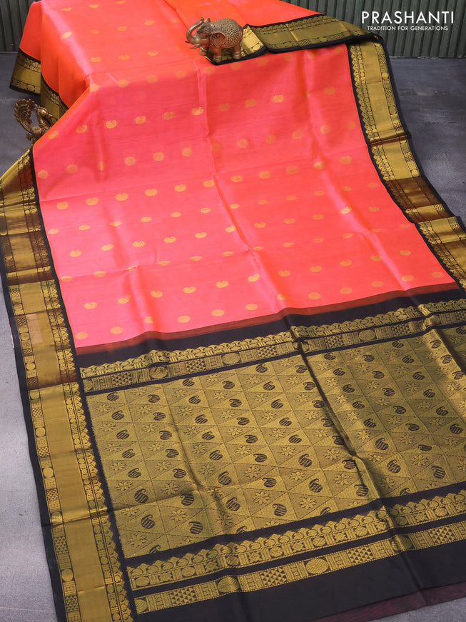 Kuppadam silk cotton saree dual shade of pinkish orange and black with zari woven buttas and rich zari woven border
