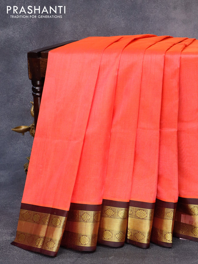 Kuppadam silk cotton saree pinkish orange and wine shade with plain body and zari woven border