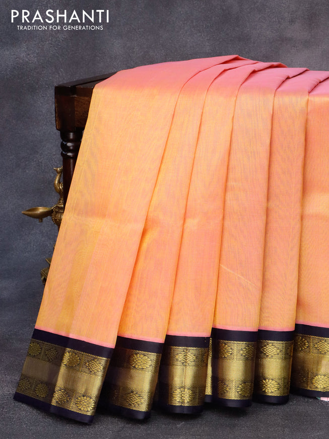 Kuppadam silk cotton saree dual shade of yellowish pink and navy blue with plain body and zari woven border