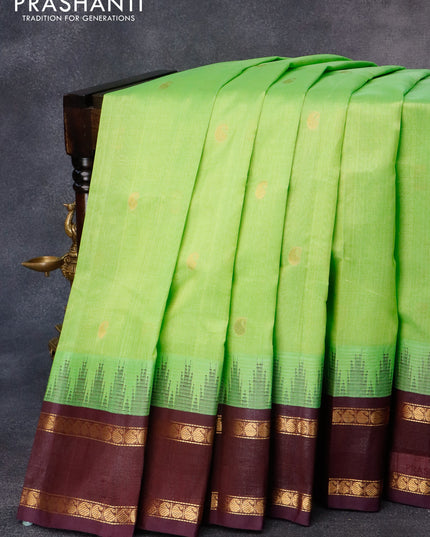 Kuppadam silk cotton saree light green and wine shade with paisley zari woven buttas and temple design rettapet zari woven border
