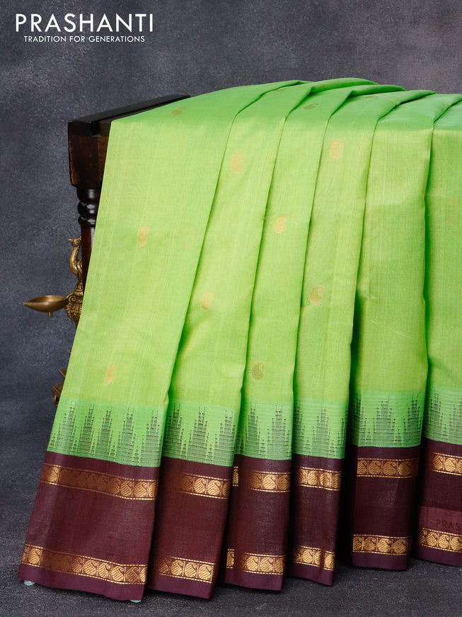 Kuppadam silk cotton saree light green and wine shade with paisley zari woven buttas and temple design rettapet zari woven border
