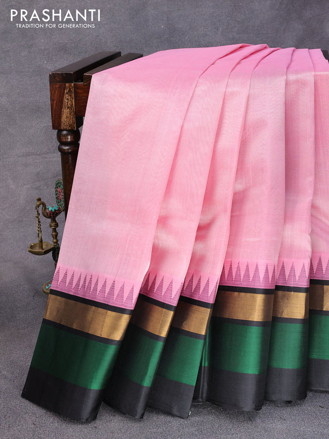 Kuppadam silk cotton saree light pink and black with plain body and temple design zari woven border