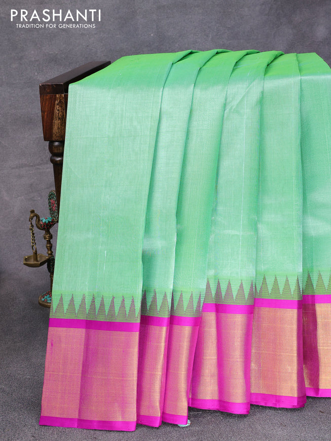 Kuppadam silk cotton saree teal green and purple with plain body and temple design zari woven border