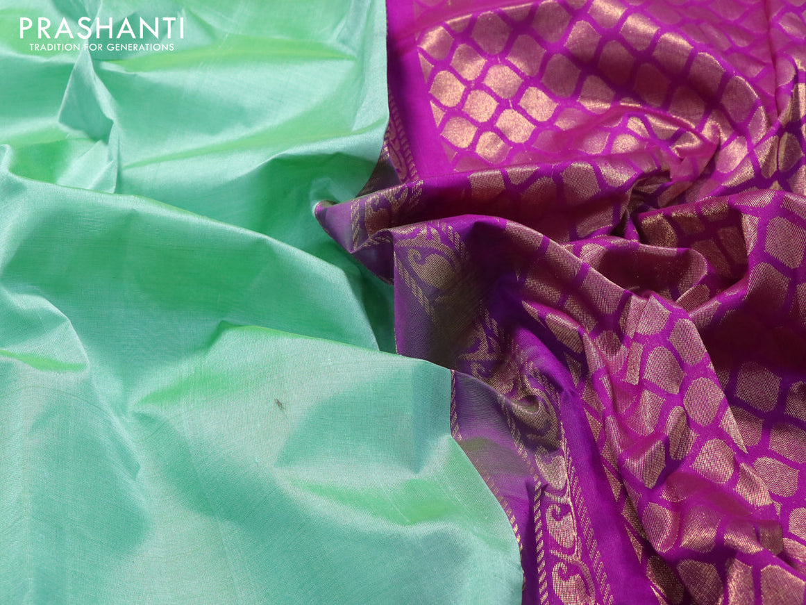 Kuppadam silk cotton saree teal green and purple with plain body and temple design zari woven border
