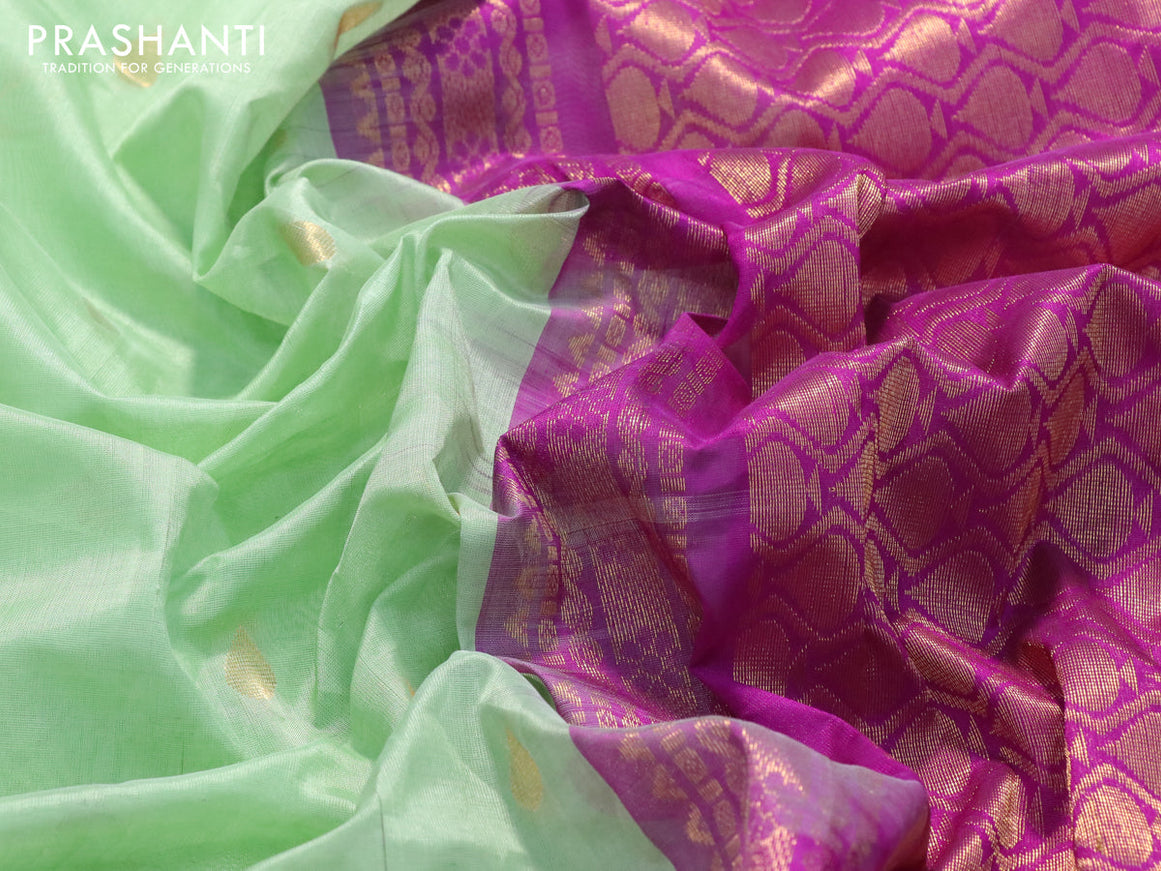 Kuppadam silk cotton saree pista green and purple with zari woven tilak buttas and long temple design zari woven butta border