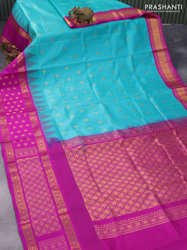 Kuppadam silk cotton saree teal blue and purple with zari woven tilak buttas and long temple design zari woven butta border