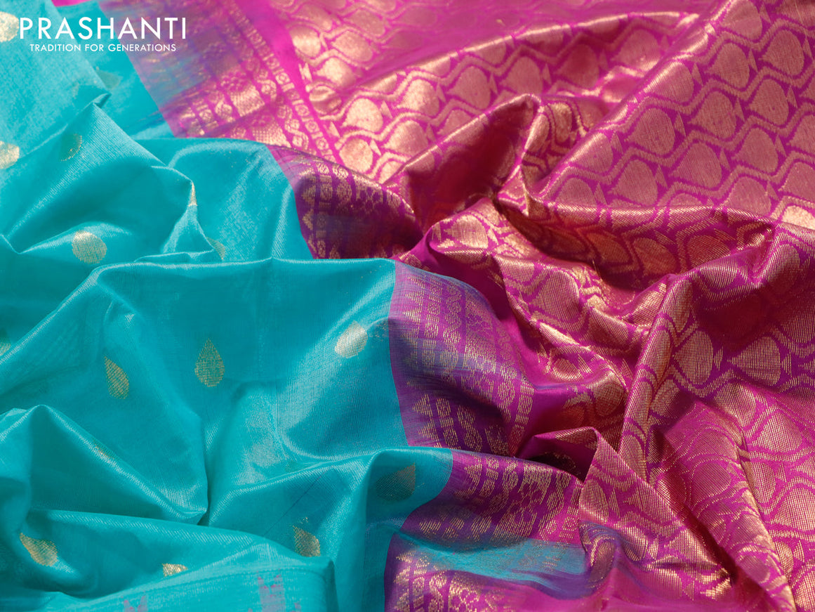Kuppadam silk cotton saree teal blue and purple with zari woven tilak buttas and long temple design zari woven butta border