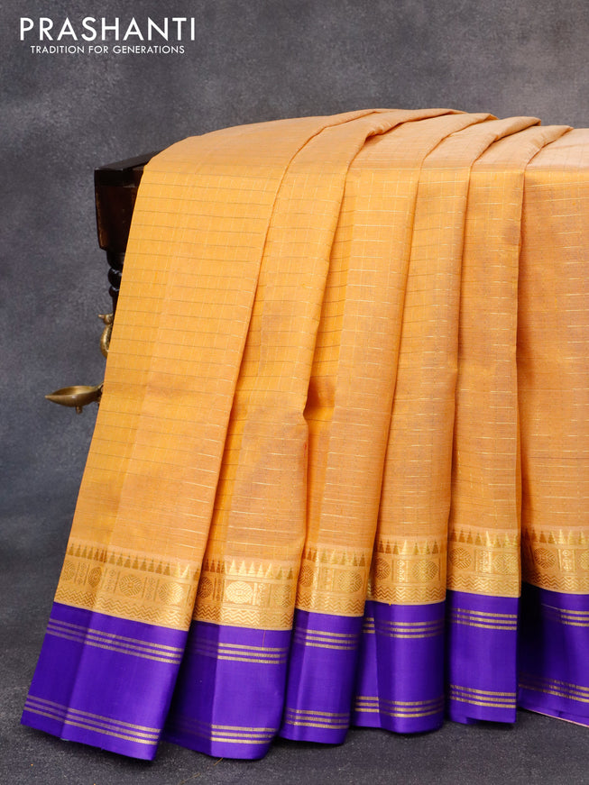 Kuppadam silk cotton saree mustard shade and royal blue with allover zari checked pattern and rudhraksha zari woven rettapet border
