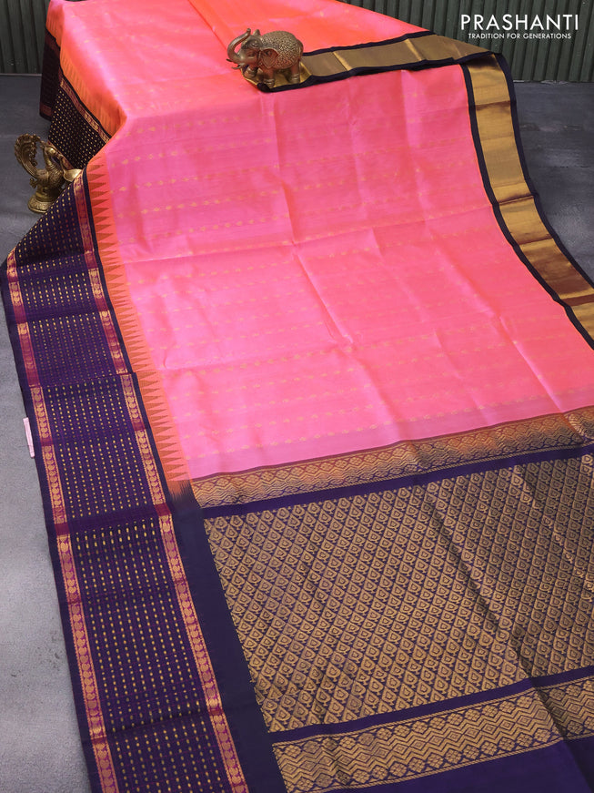 Kuppadam silk cotton saree dual shade of peach pink and navy blue with allover zari woven buttas and temple design paisley zari woven border