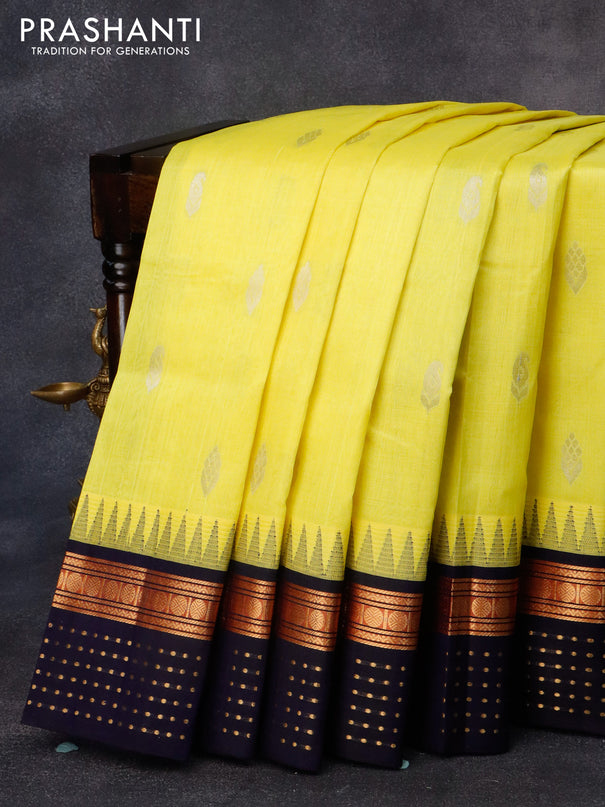 Kuppadam silk cotton saree lime yellow and navy blue with zari woven buttas and temple design rudhraksha zari woven border
