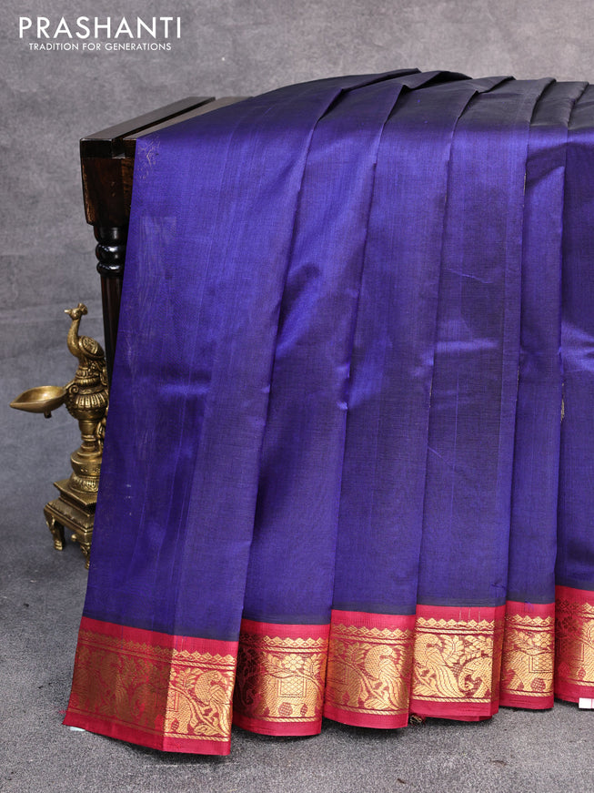 Silk cotton saree blue and maroon with peacock zari woven buttas and zari woven korvai border