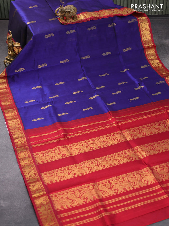Silk cotton saree blue and maroon with peacock zari woven buttas and zari woven korvai border